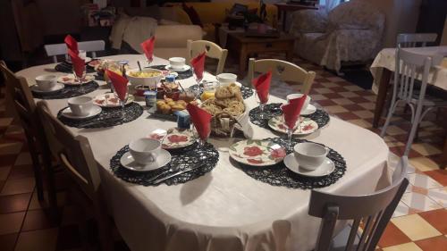 a table with plates of food on top of it at Back To Breizh in Plouhinec