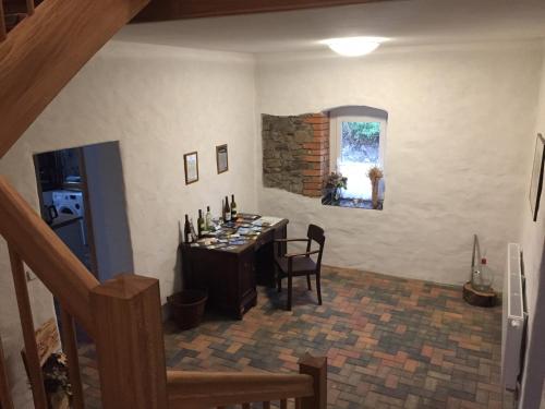 a dining room with a table and a window at Gut Fischer in Pomssen