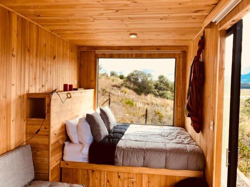 Postel nebo postele na pokoji v ubytování EnCubo Glamping Guatavita