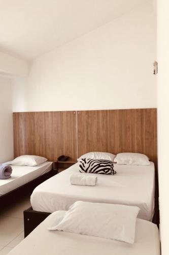 Ένα ή περισσότερα κρεβάτια σε δωμάτιο στο Hotel Center Plaza Plus