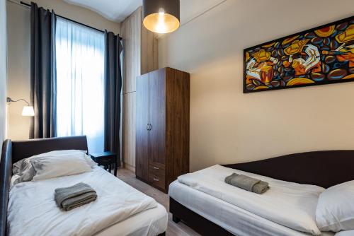 Ένα ή περισσότερα κρεβάτια σε δωμάτιο στο Center,The Rumbach suite