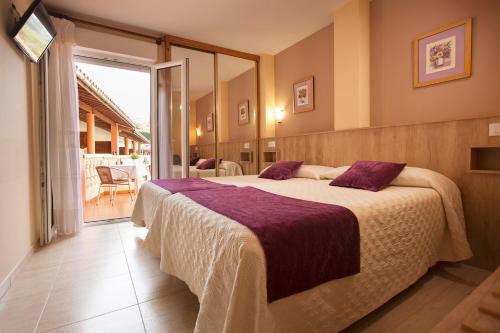 Katil atau katil-katil dalam bilik di Hotel El Refugio 3 estrellas