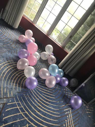 a bunch of purple and purple balloons in a room at Fullerton Manor Inn in Niagara Falls