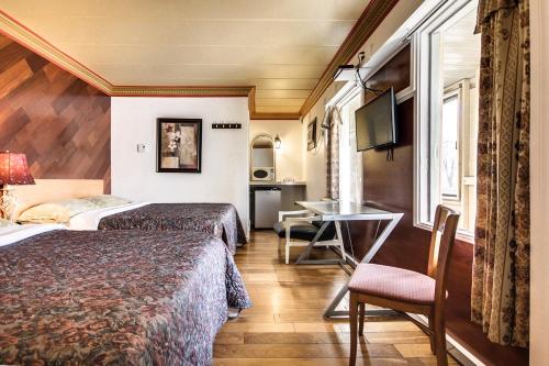 Postel nebo postele na pokoji v ubytování Motel Bellefeuille