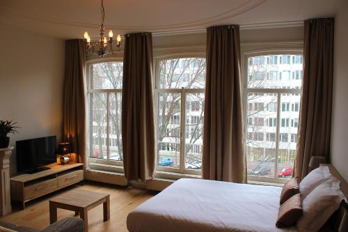 Postel nebo postele na pokoji v ubytování Amsterdam Jewel Canal Apartments