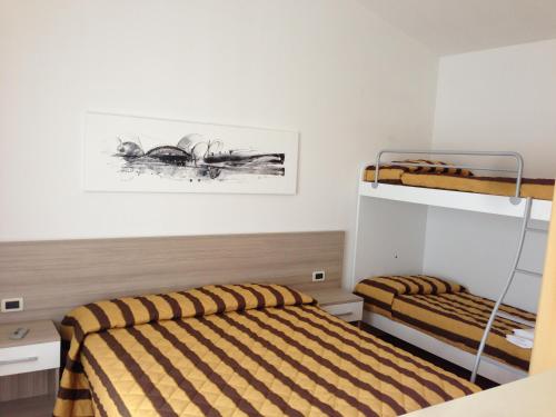 Katil atau katil-katil dalam bilik di Villaggio Margherita