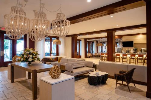 a living room with chandeliers and a lobby at Cheeca Lodge & Spa in Islamorada