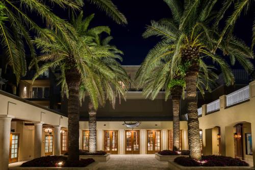 a group of palm trees in front of a building at Cheeca Lodge & Spa in Islamorada