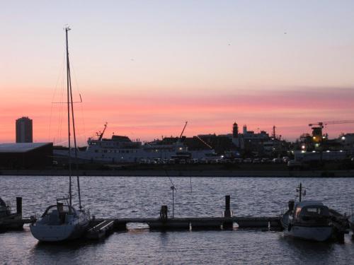 two boats are docked at a dock in the water at Appartementhaus Gouverneur-Maxse Büsum in Büsum