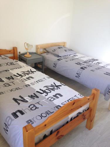 מיטה או מיטות בחדר ב-Le 43