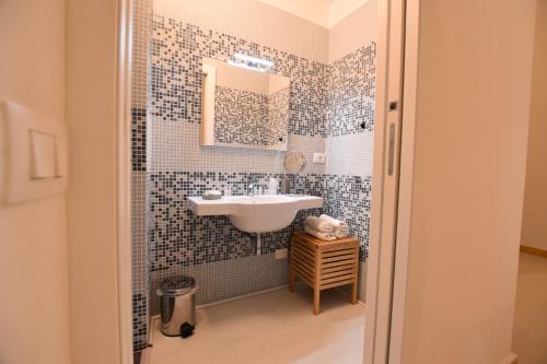 Et badeværelse på Tambù Apartments