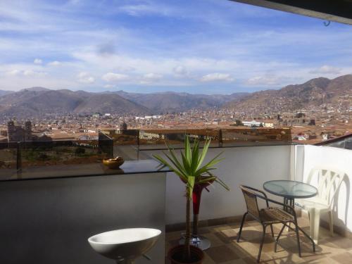 a balcony with a view of a city at Hostal Casa Del Inka in Cusco