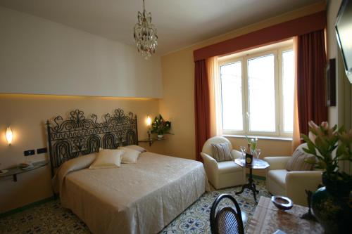 Postel nebo postele na pokoji v ubytování Sorrento Inn Guesthouse