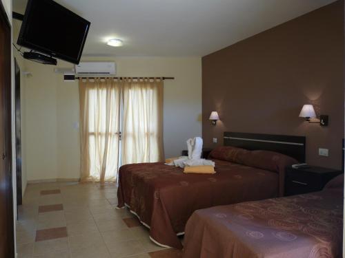 Televisyen dan/atau pusat hiburan di Apart Hotel Vista San Lucas