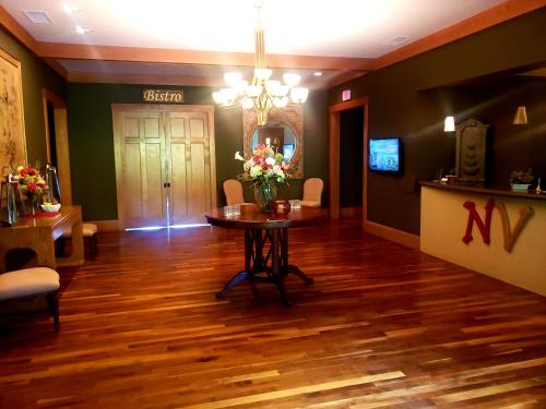 a room with a table with flowers on it at Nantahala Village in Bryson City
