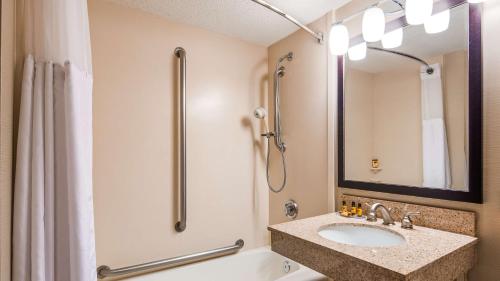 a bathroom with a sink and a shower at Best Western Plus St. Paul North/Shoreview in Shoreview