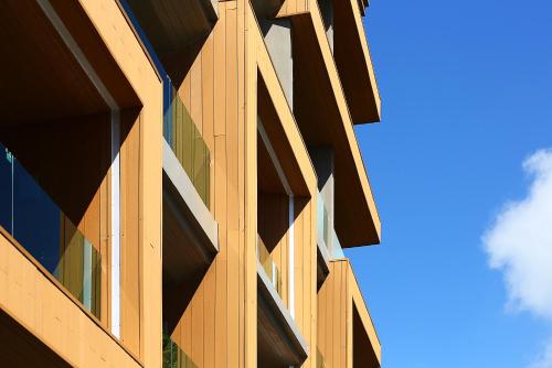 an office building with a blue sky in the background at Montana Hotel Songkhla in Songkhla