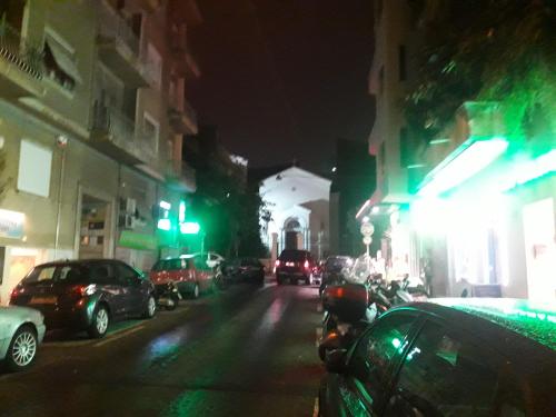 a city street at night with cars parked at Studio Posh with garden in Kolonaki in Athens