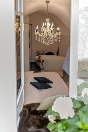 a dining room with a table with a chandelier at Passau42 in Passau