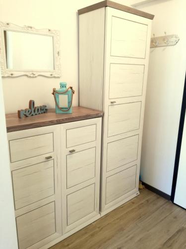 a large white cabinet in a room at Apartment Lunaja in Piran