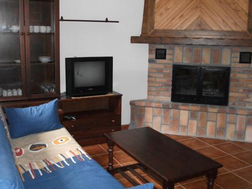Televisyen dan/atau pusat hiburan di Apartamentos Arcos de Solana