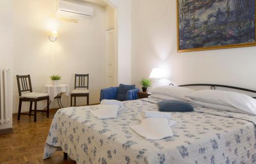En eller flere senge i et værelse på Guesthouse Bel Duomo