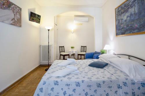 En eller flere senge i et værelse på Guesthouse Bel Duomo