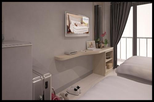 Ένα ή περισσότερα κρεβάτια σε δωμάτιο στο Expressia Stay at Serpong Greenview Apartment