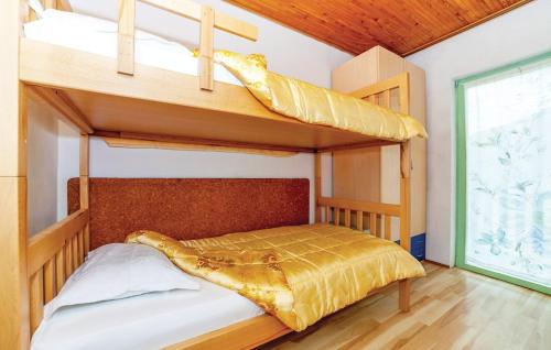 a bedroom with two bunk beds in a house at Marcos House in Mrkopalj