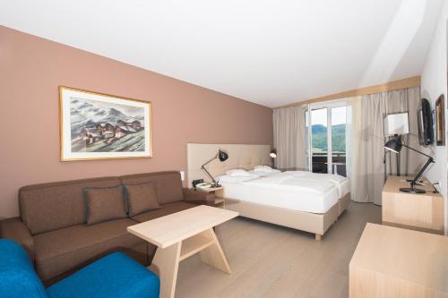 Кровать или кровати в номере Seeberg Garni Hotel