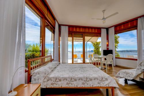 Ένα ή περισσότερα κρεβάτια σε δωμάτιο στο La Villa Fasano