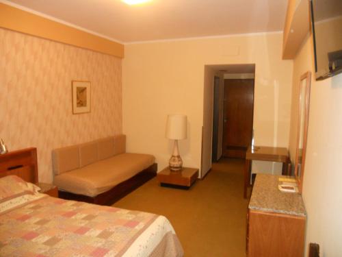 Ένα ή περισσότερα κρεβάτια σε δωμάτιο στο Hostal Santa Fe De La Veracruz