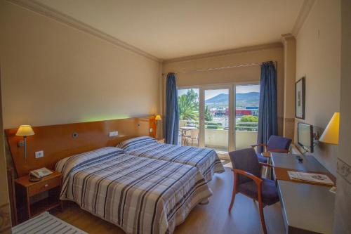 Postel nebo postele na pokoji v ubytování Hotel Azar
