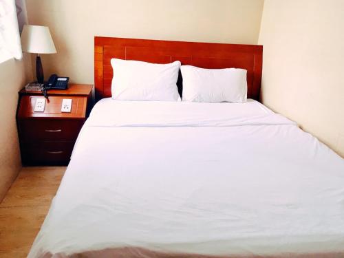 Postel nebo postele na pokoji v ubytování Thanh An Hotel