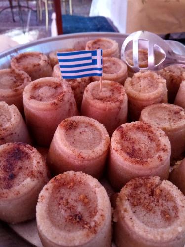 a plate of smallcakes with a flag on it at Anatoli Hotel in Agia Marina Aegina