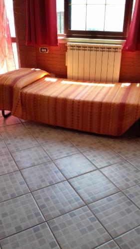 Кровать или кровати в номере Da Chicco