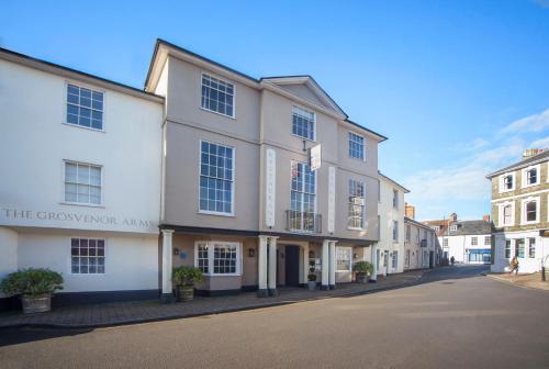 a row of white buildings on a street at The Grosvenor Arms in Shaftesbury