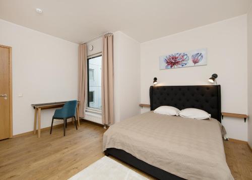 Ένα ή περισσότερα κρεβάτια σε δωμάτιο στο Foorum City Centre Apartment