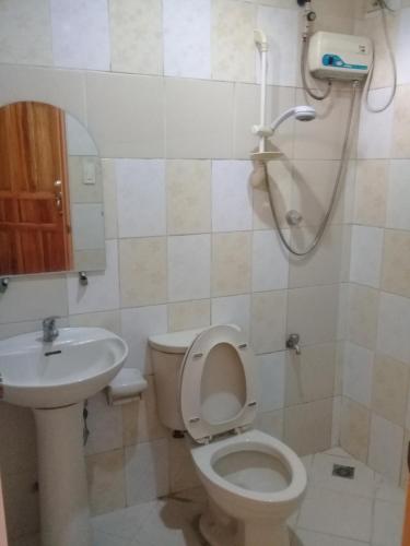 a bathroom with a toilet and a sink at ASHBURN'S TRANSIENT BAGUIO - 3rd to 5th floor BASIC SLEEP and GO Accommodation, WITH PARKING, NO ELEVATOR in Baguio