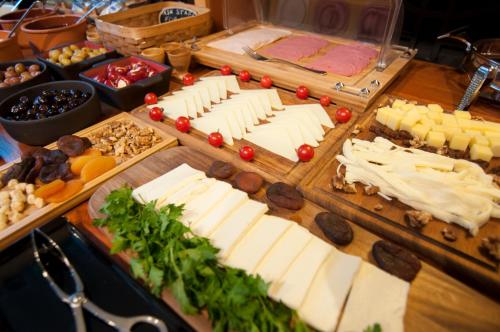 a buffet with cheese and other appetizers on a table at Nomade Hotel Exclusive in Istanbul