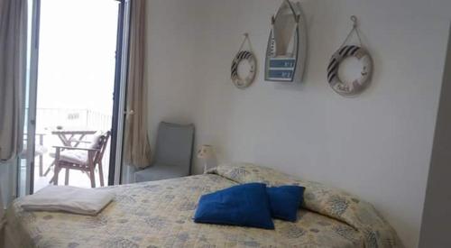 Ένα ή περισσότερα κρεβάτια σε δωμάτιο στο Casa Maritrì Locazione Turistica