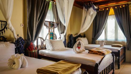 Ένα ή περισσότερα κρεβάτια σε δωμάτιο στο Smiles Beach Hotel