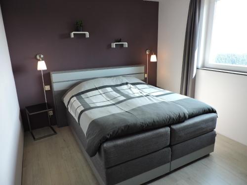 Uma cama ou camas num quarto em Landhaus Eifelsicht