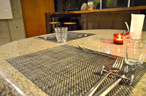 a table with a fork and napkin on a table at the Kinta Naeba in Yuzawa