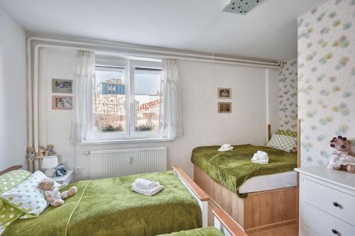 Postel nebo postele na pokoji v ubytování Apartment U Medvídka