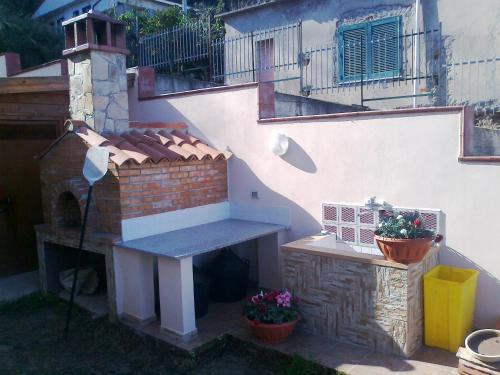 a outdoor patio with a bench and a staircase at Appartamenti Borgo Panoramico N 5 in Tropea