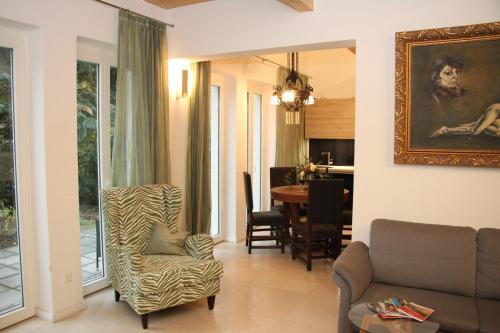 a living room with a couch and a table at Haus Sonate in Bad Schandau