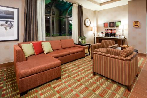 a living room with a couch and a chair at Best Western Plus St. Paul North/Shoreview in Shoreview