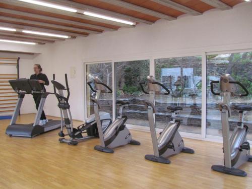 a woman in a gym with several tread machines at Carpe Diem Cadaqués in Cadaqués