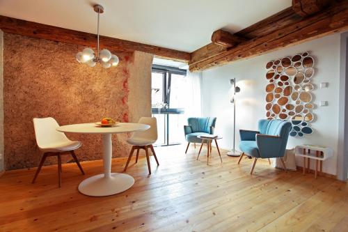 a dining room with a table and chairs at hotel rainhof scheune & naturpark restaurant (Kirchzarten) in Kirchzarten